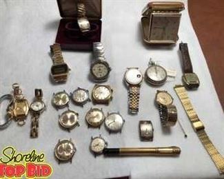 Watch collection including numerous watch faces without bands, not sure of working order