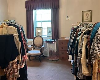 Another bedroom full of clothing racks