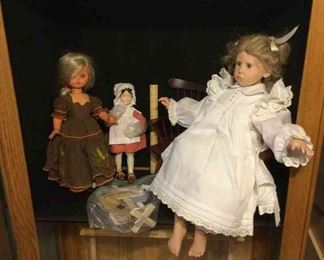 Three Dolls And Chair