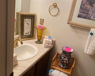 all bathroom decor, towels, vase, pictures, etc
