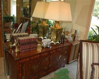Brass lamp and books on buffet