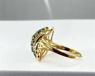 A 14K yellow gold ring with multiple blue diamonds & white diamonds. 4.00 gr.     $180.-