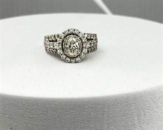 An 18K white gold engagement ring with Diamonds.