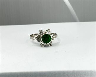 14K white gold, flower shape ring with Emerald & CZ stone. 2.70 gr.      $130.-