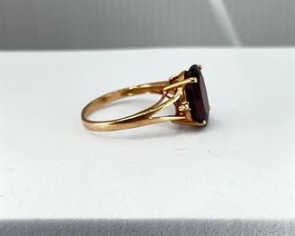 14K rose gold ring with Opal shape Garnet & Diamonds. 3.20 gr. $145.-