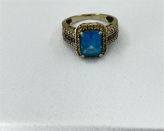14K white gold ring Rectangle Blue Topaz with Diamonds. 3.90 gr. $180.-