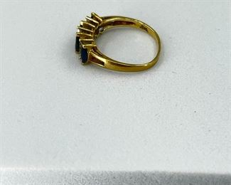 14K yellow gold ring with blue sapphire and diamonds. 2.8 gr. $130.-