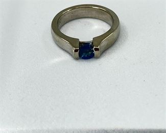 14K white gold Ring with One Small Blue Topaz stone. 8.20 gr.- $370.-