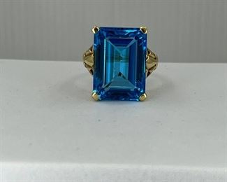 10K yellow gold ring with One very Big Blue Topaz Stone. 8.50 gr. $300.-