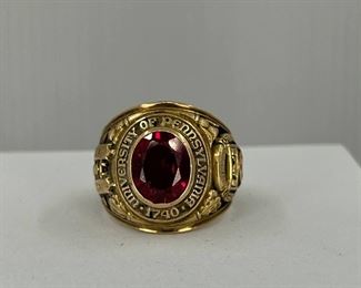 10K yellow gold Ring with a carving of the University of Pennsylvania & Red Glass. 23.20 gr. $820.-
