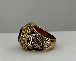 10K yellow gold Ring with a carving of the University of Pennsylvania & Red Glass. 23.20 gr. $820.-