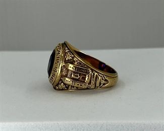 10K yellow gold Ring with a carving of the University of Pennsylvania & Blue & Red Glass. 10.60 gr. $375.-