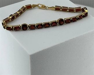 14K yellow gold Bracelet Pieces attach to each other with Red Glasses. 8.30 gr. $300.-