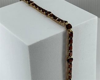 14K yellow gold Bracelet Pieces attach to each other with Red Glasses. 8.30 gr. $300.-