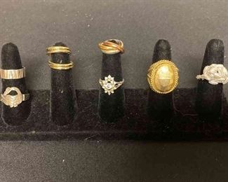 Seven Silver Colored Or Gold Colored Rings