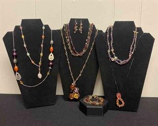 Six Purple And Orange Necklaces And One Bracelet And One Pair Of Earrings