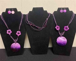 Three Purple Beaded Necklaces And Two Pairs Of Earrings