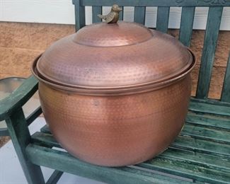 Copper garden hose outdoor container.