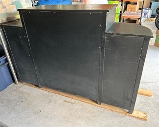 $800.00     Custom Black Sideboard - Solid wood - distressed - acrylic crystal knobs - textured glass doors - 2 large drawers, two small drawers, the cabinet has one shelf, two shelves flank each side - decorative wood detail. Some rust exists on the metal backer of the knobs.                           Total width 65"                                                                                      Middle section 38" W x 19"D x 42"H  (7.5"H from sides)                                          Curved Sides 14" W  x 17.5"D                                                                                                