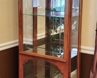 1 of 2 matching glass lighted display cabinets.