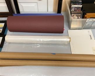 Several tables of framing supplies, sold all together.