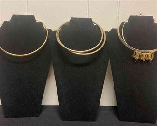 Five Circular Gold Colored Necklaces