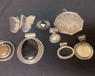 Eight Silver Colored Pendants