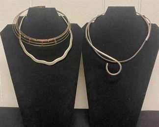 Four Circular Metal Like Necklaces