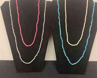 Four Different Colored Beaded Necklaces