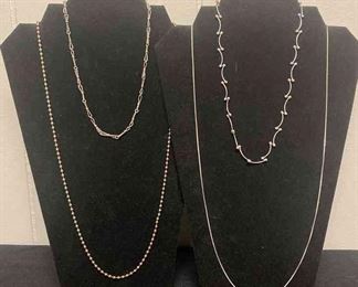 Four Silver Colored Necklaces