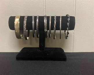 Nine Silver Colored Bracelets