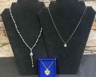 Three Silver Colored Necklaces