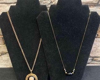Two Gold Colored Black Accented Necklaces
