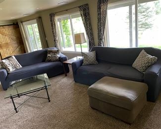 Two. Regular size couches., They are both the color of the Ottoman with blue covers on them at this point. I pulled one blue cover off, and the couch was in good condition. 82” long, 38” deep