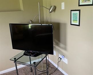 TV and glass and metal table 