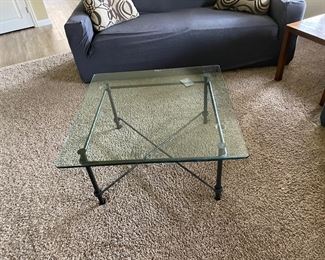 Matching glass and metal table, there are three total