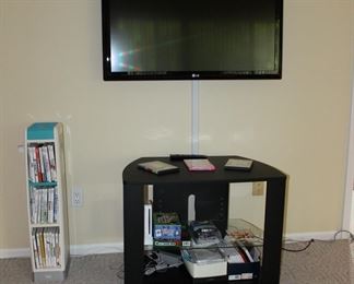 Tv Stand, WII, and Dvds and LG TV