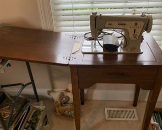 #143	singer sewing machine 237 in wood case	 $50.00 			
