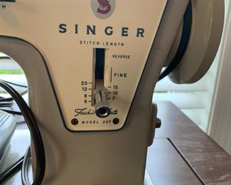 #143	singer sewing machine 237 in wood case	 $50.00 			

