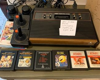 #146	Atari CX-2600A  with 2 joysticks 2 paddles and 6 games	 $125.00 			
