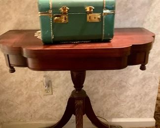 A beautiful table and a precious train case. 