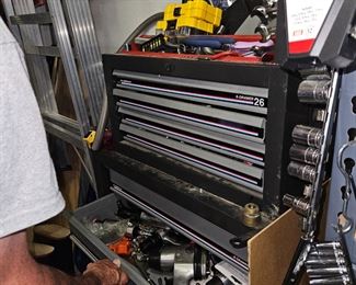 tools and a tool chest  located down stairs.