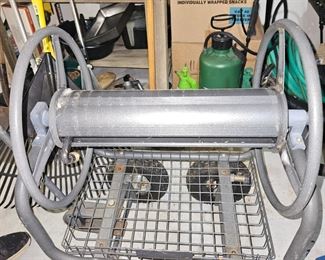 Large hose reel located downstairs.