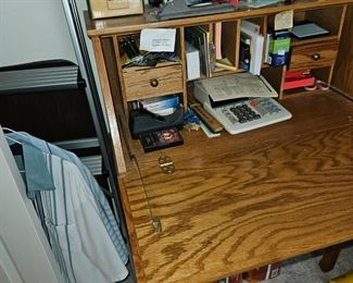 Desk opens to a writing table. many cubbies. lots of office supplies.  upper bedroom, end of hall turn left on left.