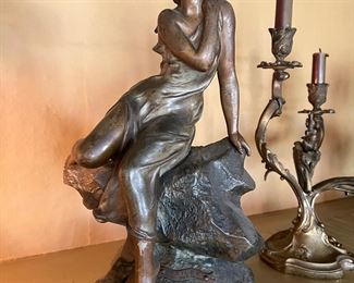 Beautiful sculpture statue of a woman seated on a rock, titled Exilee, and design attributed to Julien Causse 