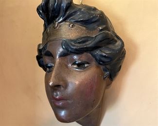 Antique decorated ceramic wall hanging mask of woman, potentially depicting a Moorish woman from the Orientalist period. 