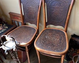 Beautiful antique chairs with pressed embossed leather deaign. 