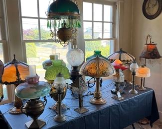 Dozens of antique lamps in Victorian, Asian, Art Deco, and Art Nouveau styles