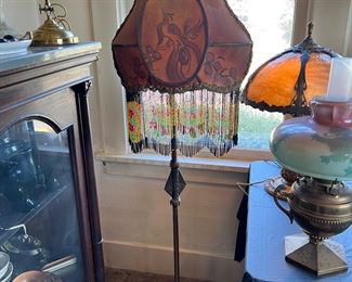 Antique floor lamp with beautiful beaded fringe shade, featuring a bird (potentially a peacock or phoenix) 