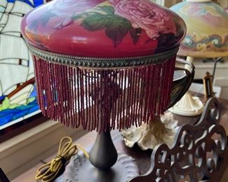 Antique art nouveau electric lamp with beautiful pink and yellow floral glass shade with beaded trim, with a P&S switch. 